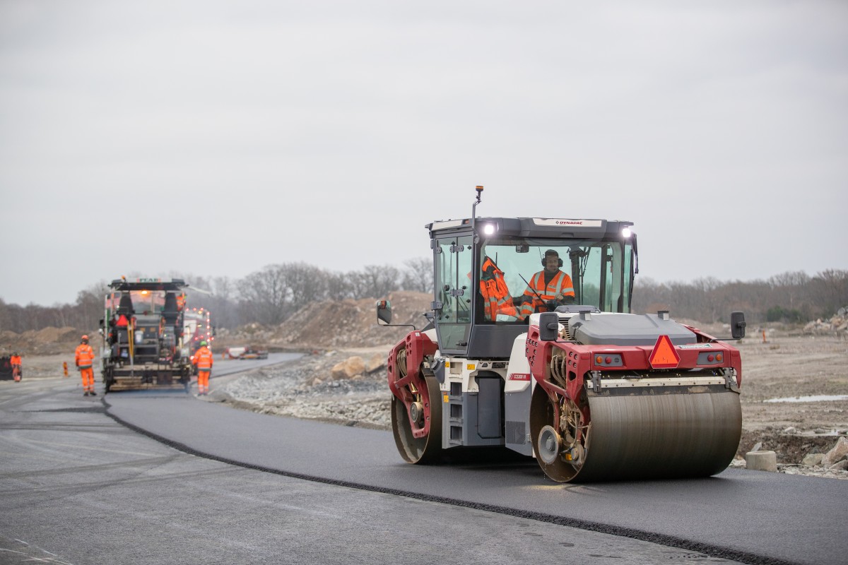 The Dynapac CO5200 VI tandem roller is on the road